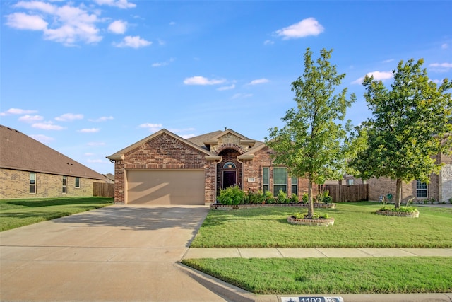 view of front facade with a garage and a front lawn