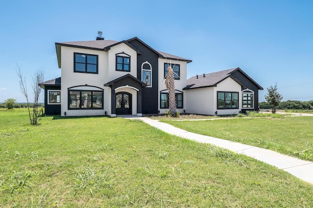 view of front facade featuring a front yard