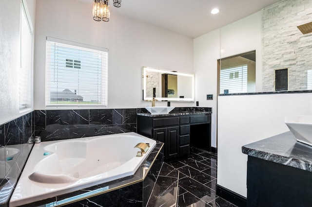 bathroom with a relaxing tiled tub, tile patterned flooring, dual vanity, and a healthy amount of sunlight