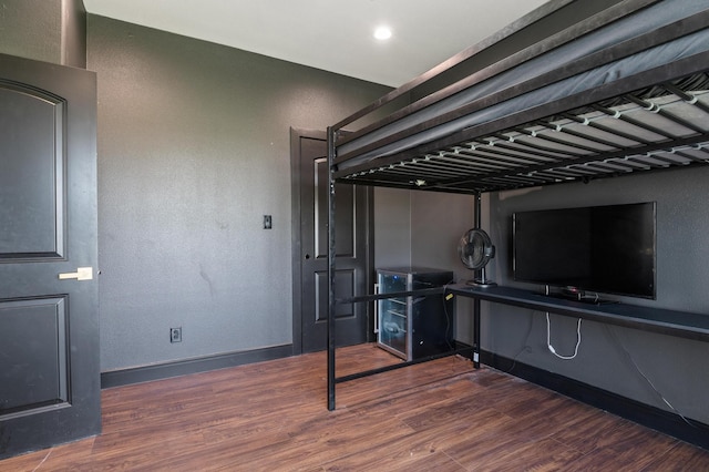 bedroom featuring wood-type flooring