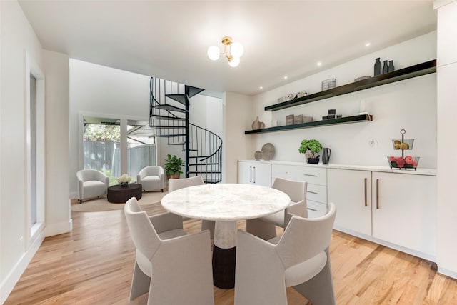 dining space with light hardwood / wood-style floors