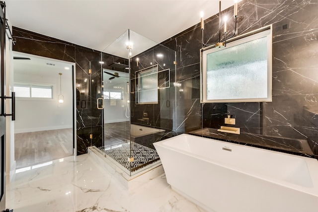 bathroom featuring tile walls and plus walk in shower