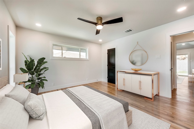 bedroom featuring hardwood / wood-style flooring and ceiling fan