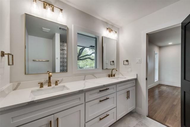 bathroom featuring vanity and hardwood / wood-style floors