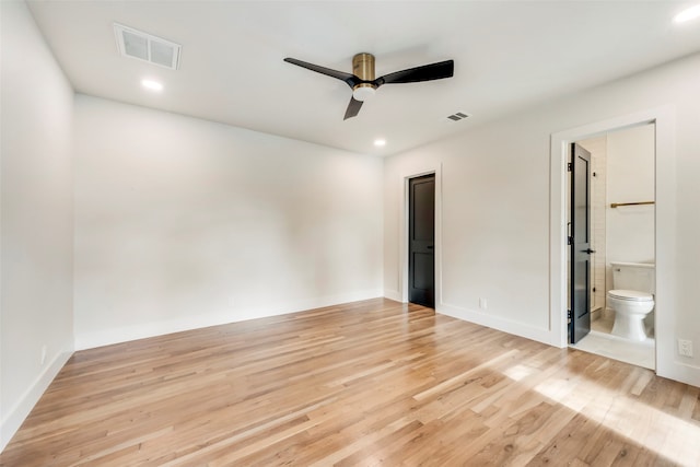 unfurnished bedroom featuring ceiling fan, light hardwood / wood-style floors, and ensuite bath