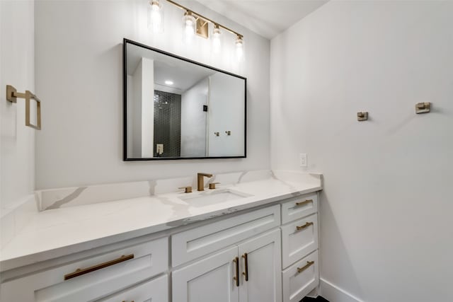 bathroom featuring an enclosed shower and vanity