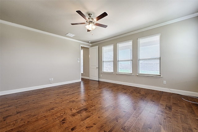 spare room featuring ceiling fan, dark wood-type flooring, and ornamental molding