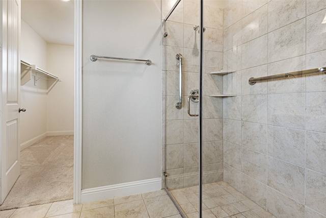 bathroom featuring tile patterned floors and an enclosed shower