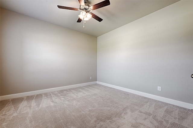 spare room featuring ceiling fan and carpet flooring