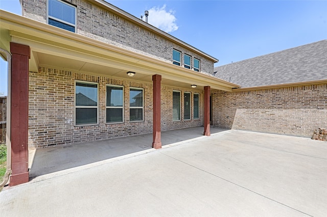 back of property with a patio area