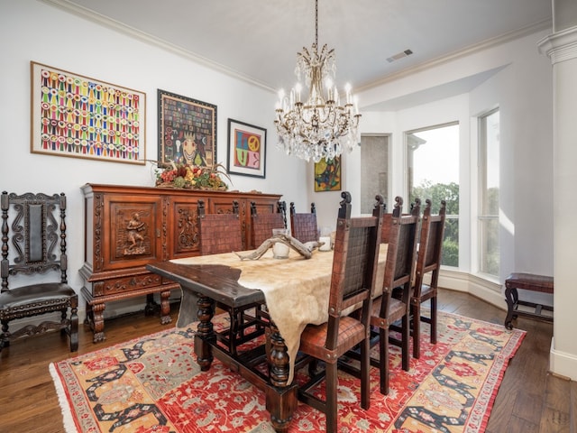 dining room featuring a chandelier, crown molding, and dark hardwood / wood-style flooring