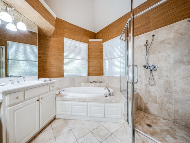 bathroom with independent shower and bath, vanity, and tile patterned floors