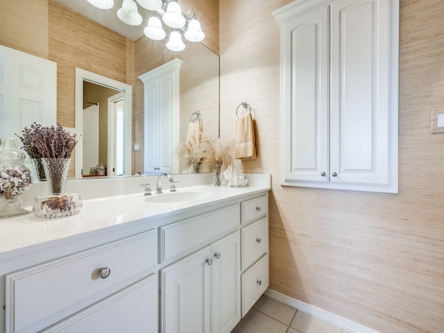 bathroom featuring vanity, tile patterned floors, and a chandelier