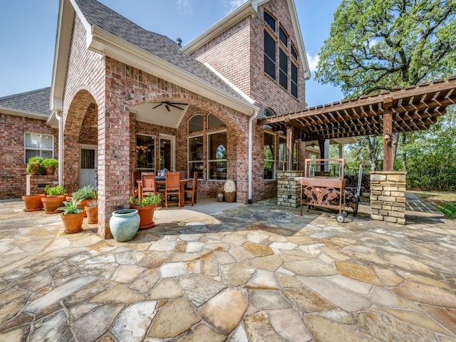 view of patio with ceiling fan and a pergola