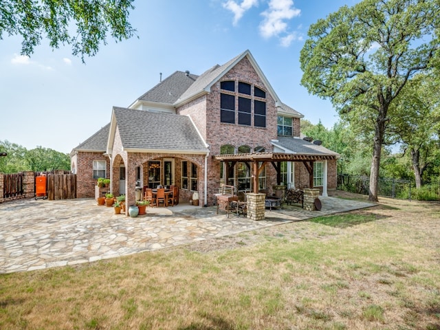 back of property featuring a patio and a lawn