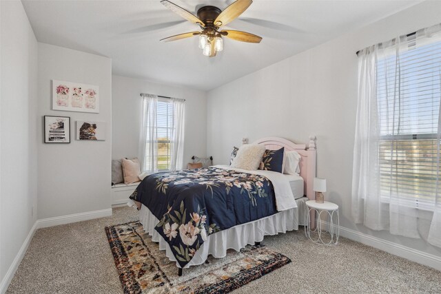 bedroom featuring ceiling fan and light colored carpet