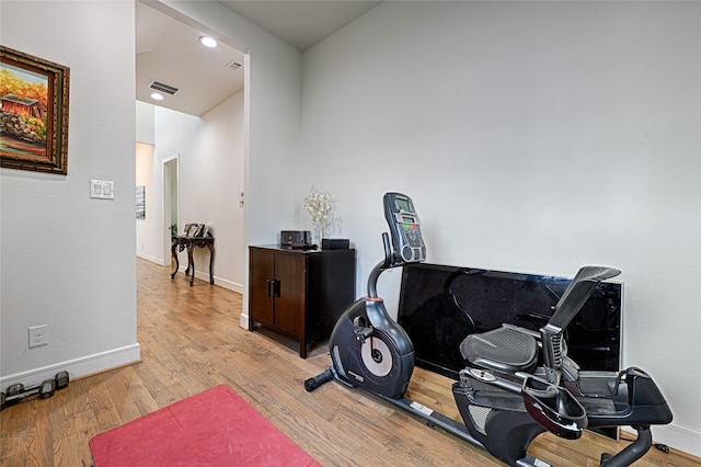 workout area featuring light hardwood / wood-style floors