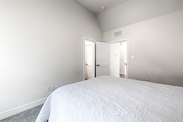 carpeted bedroom featuring lofted ceiling, visible vents, and baseboards