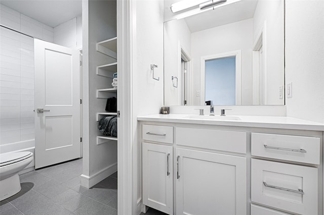 bathroom with shower / bath combination, toilet, tile patterned flooring, vanity, and a closet