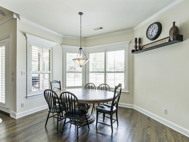 dining room featuring ornamental molding and dark hardwood / wood-style flooring