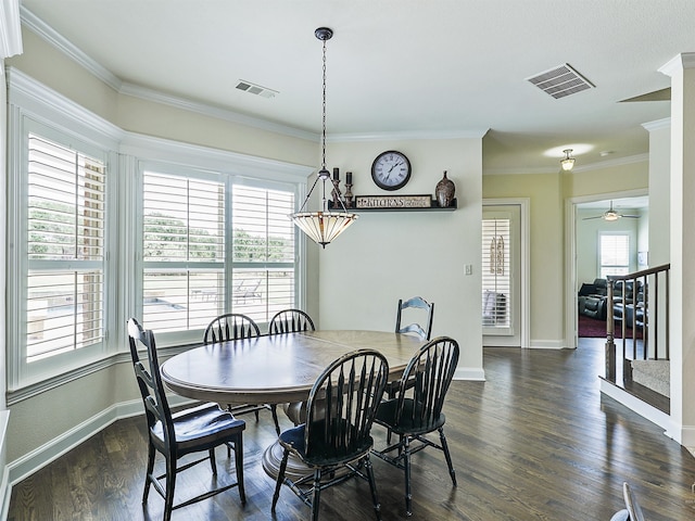 dining area featuring crown molding, dark hardwood / wood-style floors, and ceiling fan