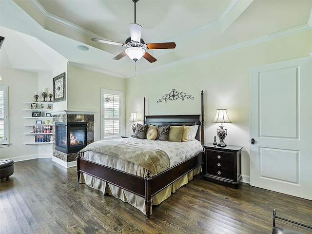 bedroom with ornamental molding and wood finished floors