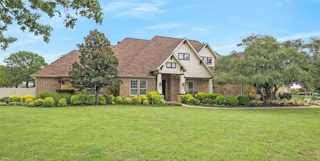 view of front of property featuring brick siding and a front lawn