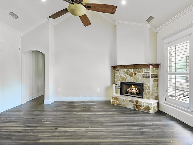 unfurnished living room with dark hardwood / wood-style floors, a fireplace, lofted ceiling, ceiling fan, and crown molding