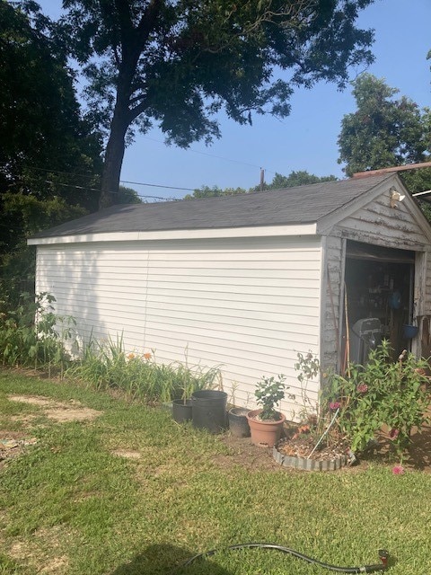 garage featuring a yard