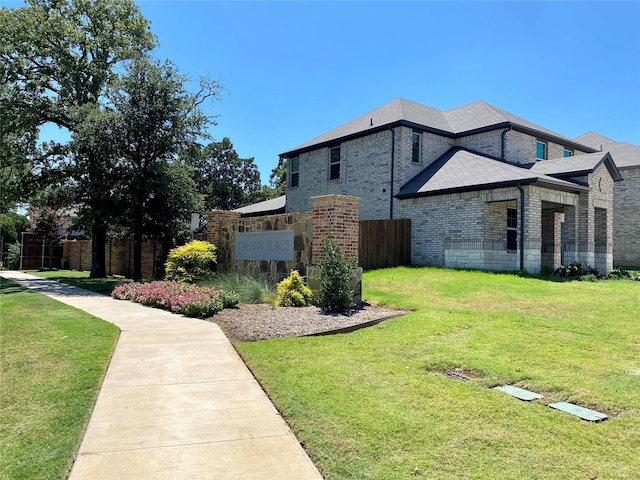 view of side of property with a lawn