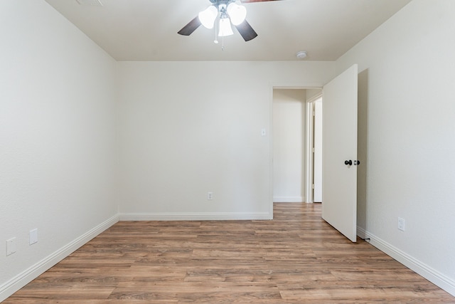 spare room featuring ceiling fan and hardwood / wood-style floors