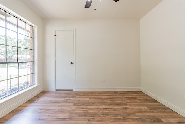 empty room with wood-type flooring and ceiling fan