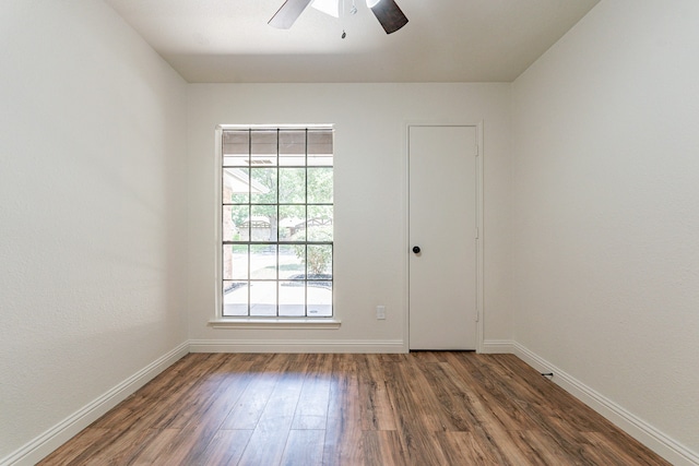 empty room with hardwood / wood-style flooring and ceiling fan