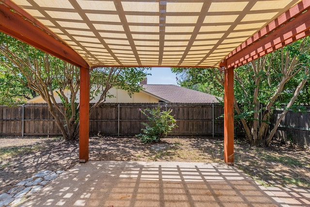 view of patio / terrace featuring a fenced backyard and a pergola