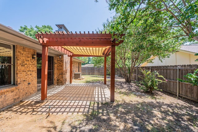 view of yard with a patio, a fenced backyard, and a pergola