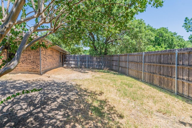 view of yard with a fenced backyard