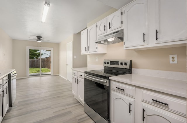 4500 Larner St, The Colony, TX 75056 - kitchen with under cabinet range hood, stainless steel electric range oven, ceiling fan, and white cabinetry