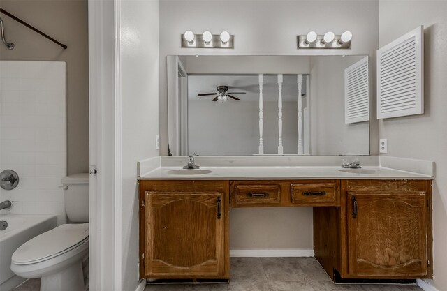 full bathroom featuring vanity, bathing tub / shower combination, tile patterned flooring, toilet, and ceiling fan