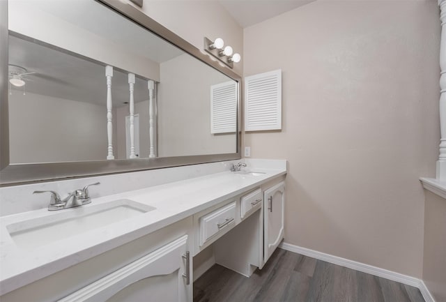 4500 Larner St, The Colony, TX 75056 - bathroom with wood finished floors, baseboards, double vanity, and a ceiling fan