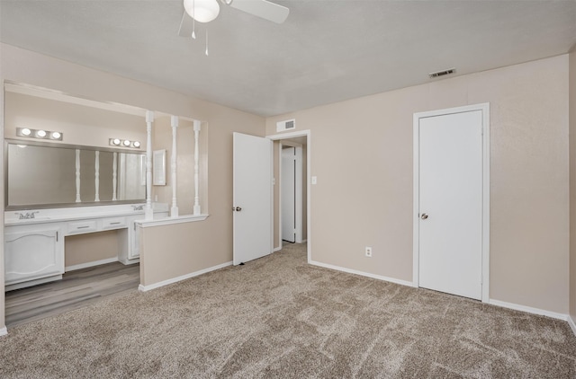 4500 Larner St, The Colony, TX 75056 - unfurnished bedroom featuring carpet flooring, baseboards, ensuite bathroom, and a desk