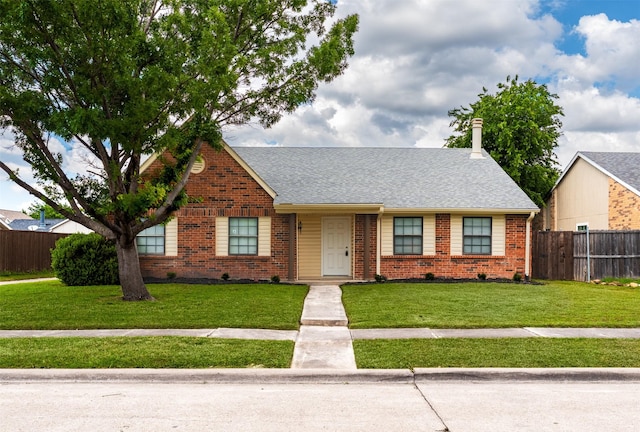 4500 Larner St, The Colony, TX 75056 - view of front of home with brick siding and roof with shingles