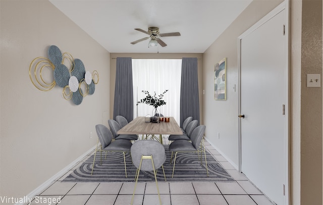 dining area with light tile patterned floors and ceiling fan