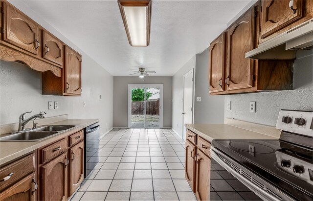 kitchen with appliances with stainless steel finishes, light tile patterned floors, sink, and ceiling fan