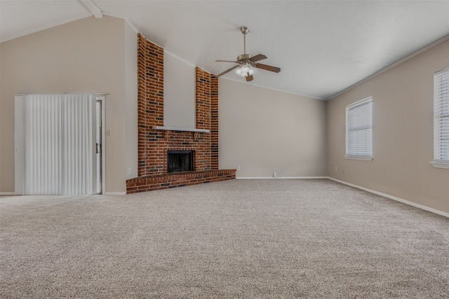 unfurnished living room with ceiling fan, a fireplace, carpet, and vaulted ceiling with beams