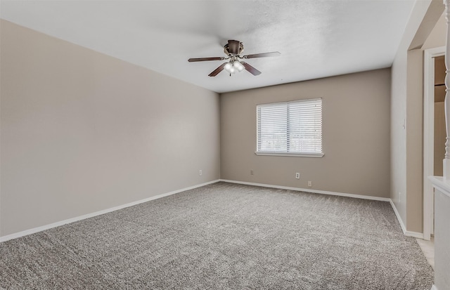 4500 Larner St, The Colony, TX 75056 - spare room featuring a ceiling fan, light colored carpet, and baseboards