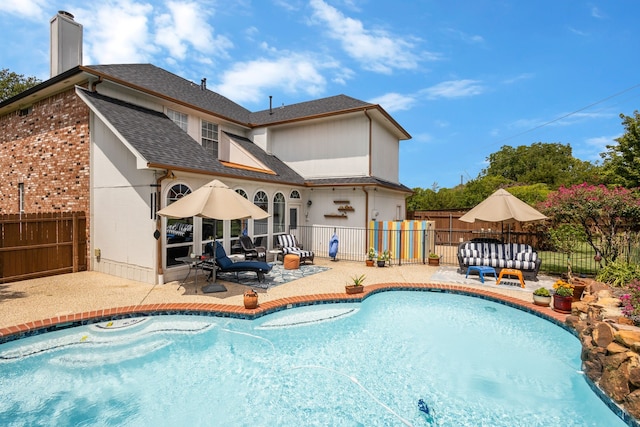 view of swimming pool with a patio and an outdoor hangout area