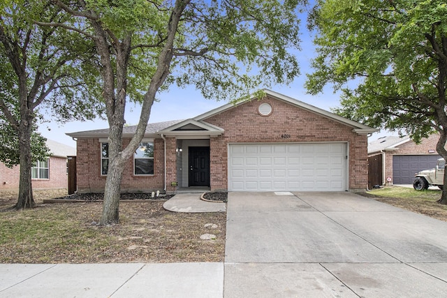 single story home with a garage