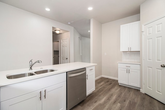 kitchen featuring sink, backsplash, light hardwood / wood-style floors, white cabinetry, and dishwasher