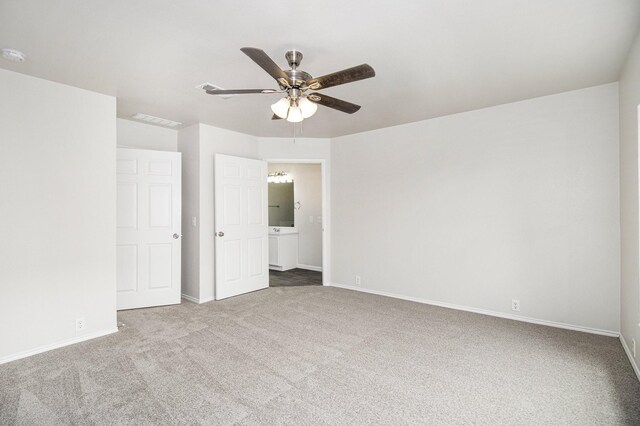 unfurnished bedroom featuring carpet and ceiling fan