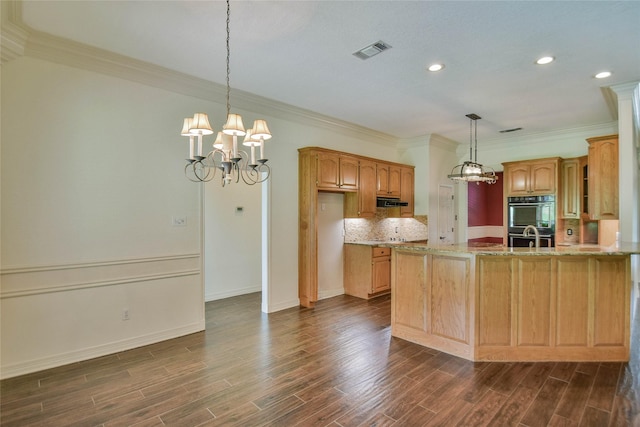 kitchen with light stone counters, hanging light fixtures, dark wood-type flooring, and black double oven